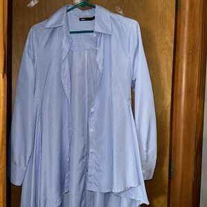 Long in the back short in the front blue and white striped blouse.